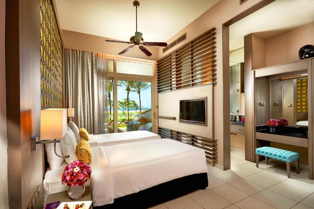 Postel nebo postele na pokoji v ubytování Sentido Heritance Negombo