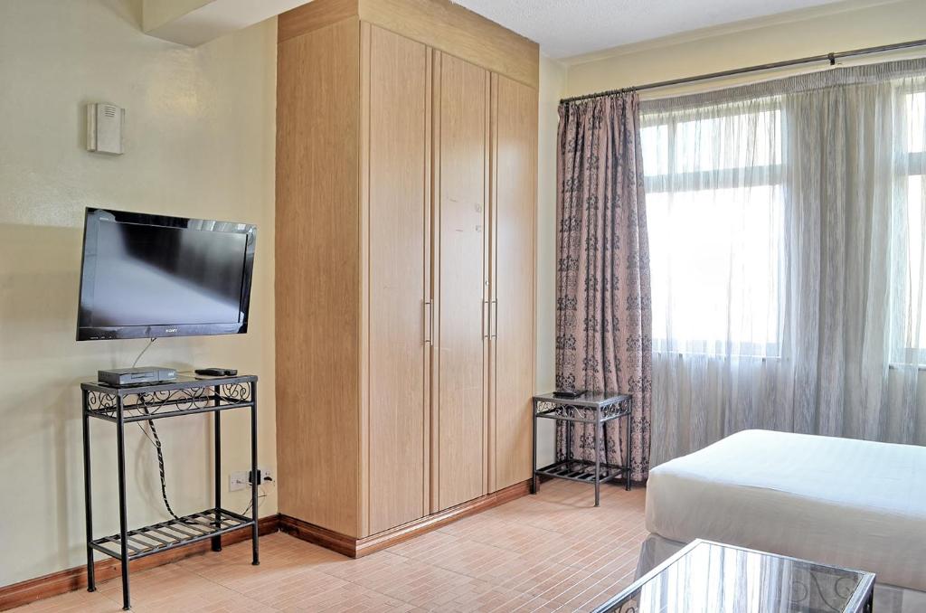 TV a/nebo společenská místnost v ubytování Space International Hotel
