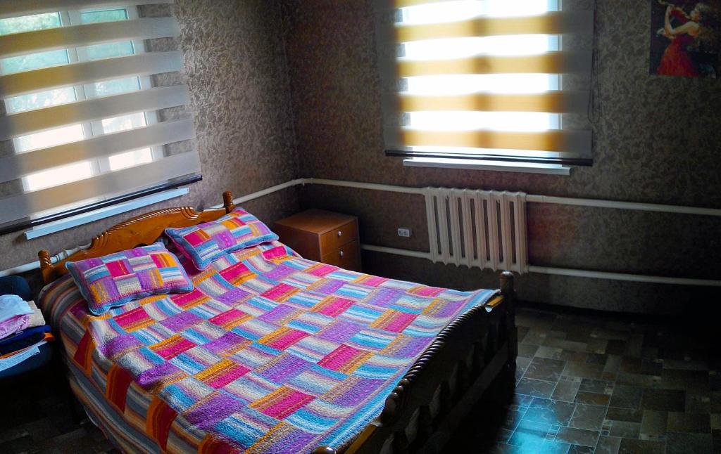 Postel nebo postele na pokoji v ubytování Tian-Shan Guest House