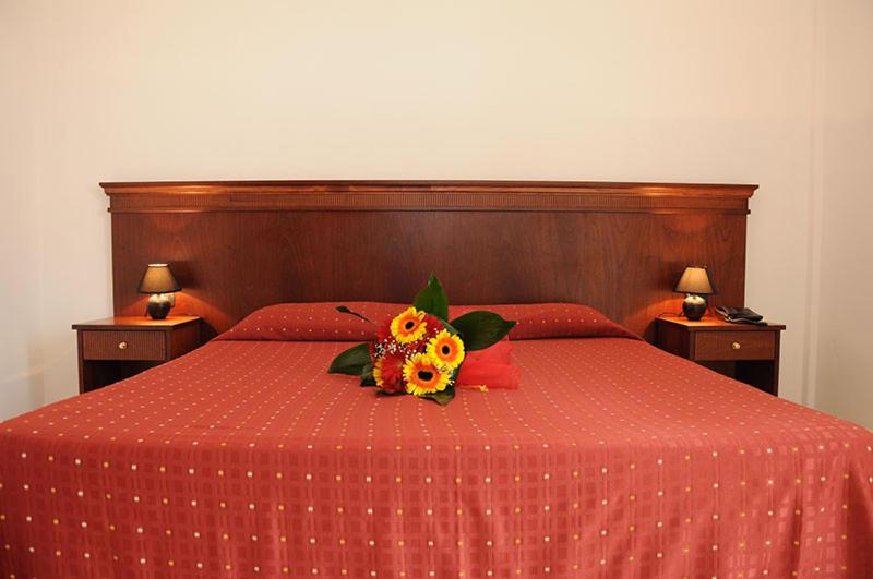 Postel nebo postele na pokoji v ubytování Agri Hotel Conte Salentino