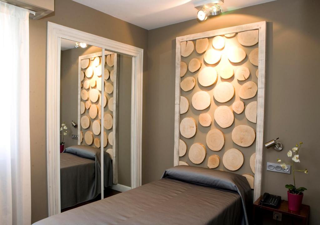 Postel nebo postele na pokoji v ubytování Hotel Salbatoreh