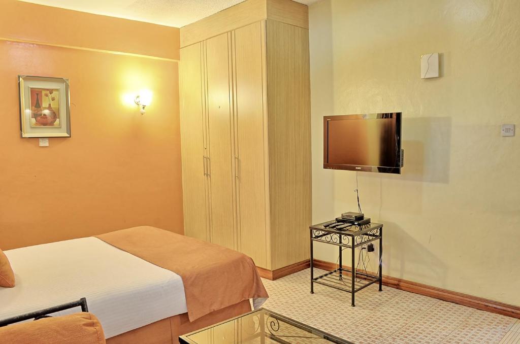 Postel nebo postele na pokoji v ubytování Space International Hotel