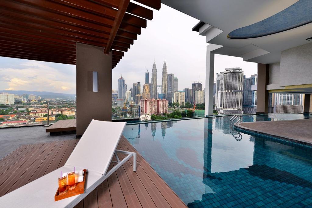 a swimming pool with a view of the city at Tamu Hotel & Suites Kuala Lumpur in Kuala Lumpur