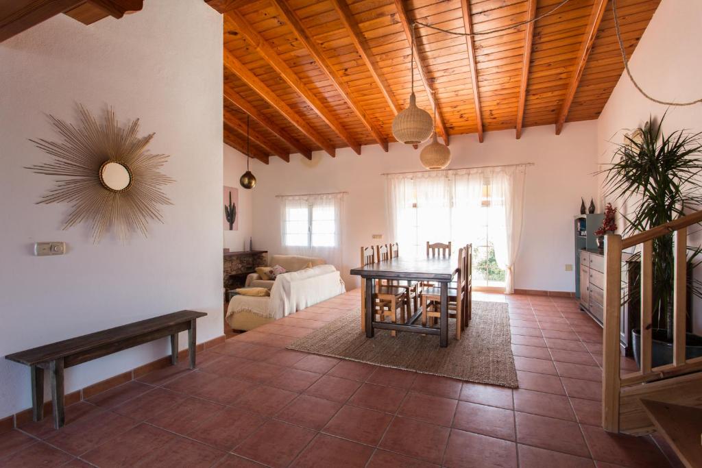 a living room with a table and a couch at Can Juan Pedro in La Mola