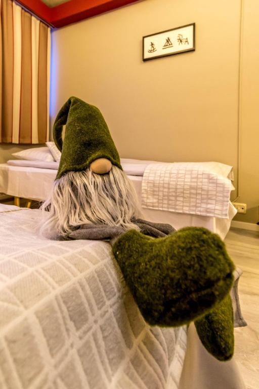 Vuode tai vuoteita majoituspaikassa Santa's Hotel Rudolf