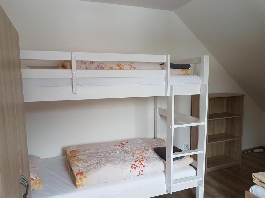 Postel nebo postele na pokoji v ubytování Apartmány TAS