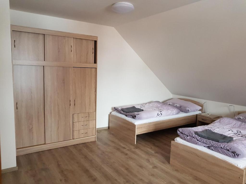 Postel nebo postele na pokoji v ubytování Apartmány TAS