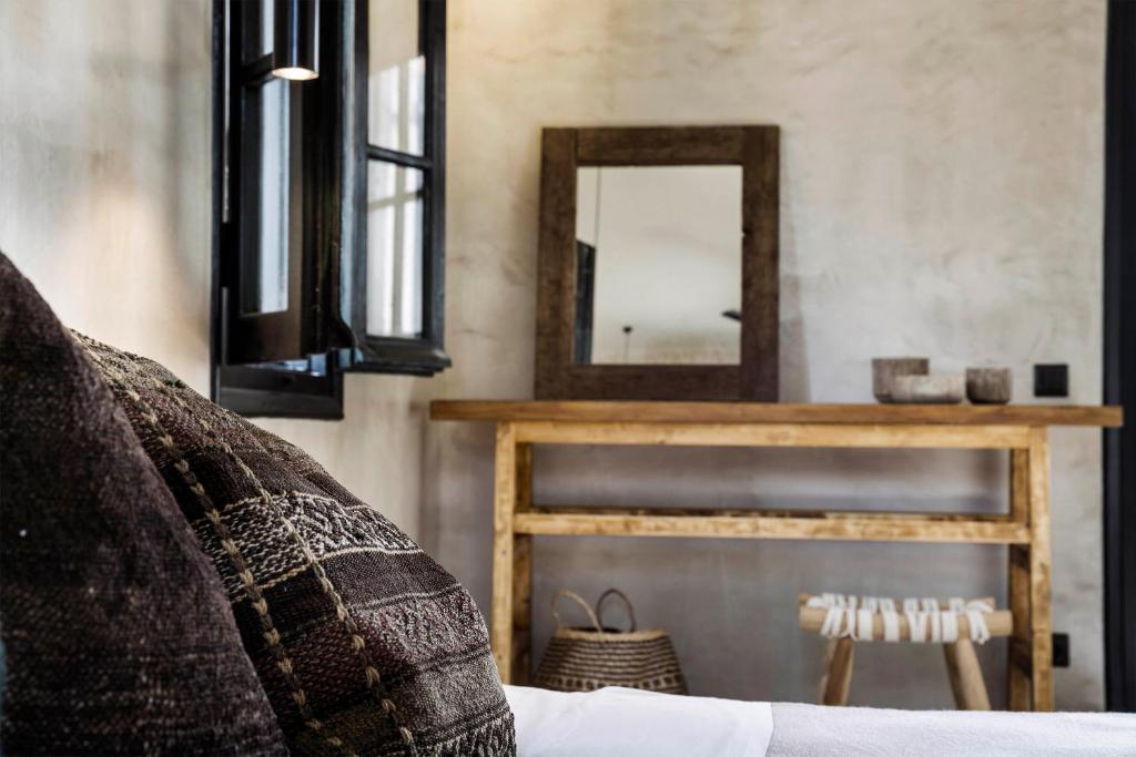 Ένα ή περισσότερα κρεβάτια σε δωμάτιο στο Kymata Bohemian Villas