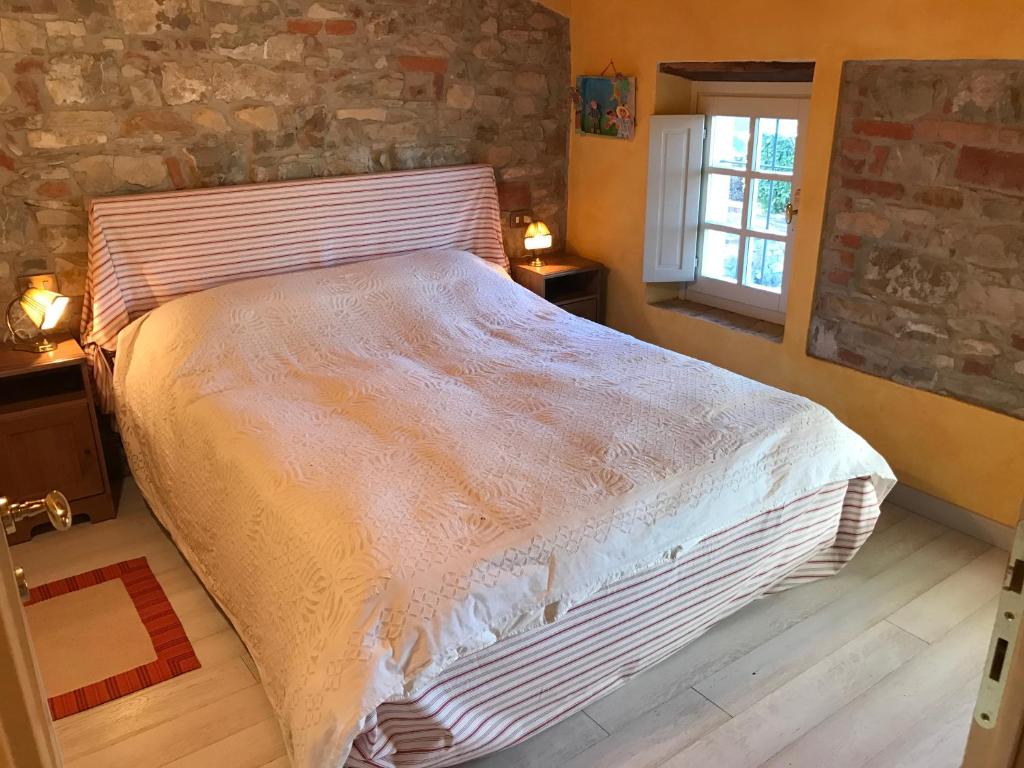 A bed or beds in a room at Casa Colli Piacentini