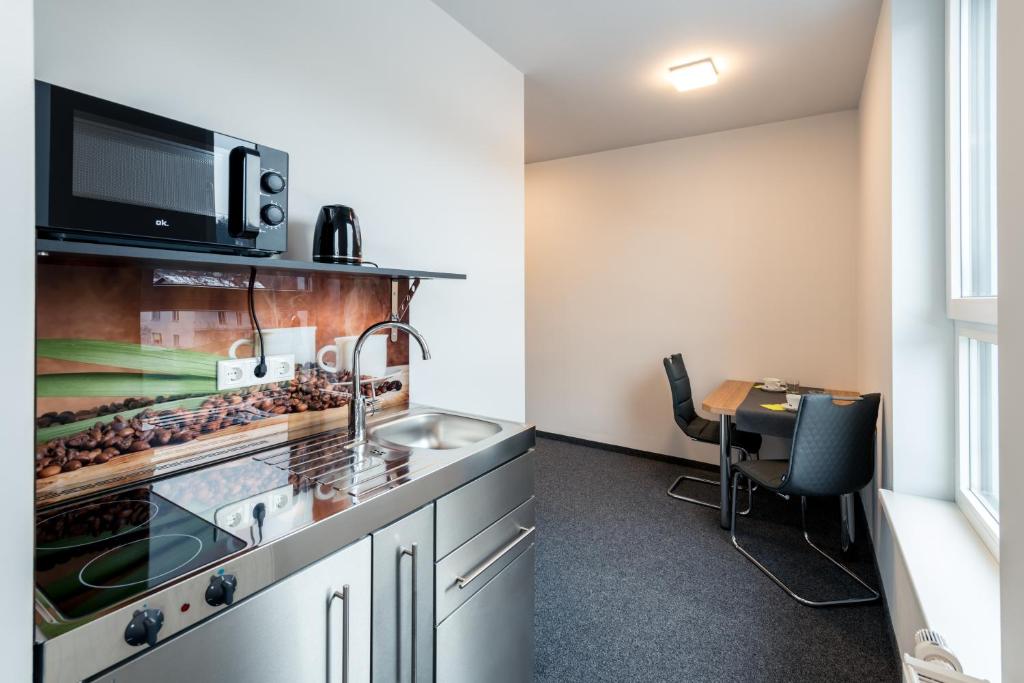 Kuchyň nebo kuchyňský kout v ubytování Motel Grieskirchen superior