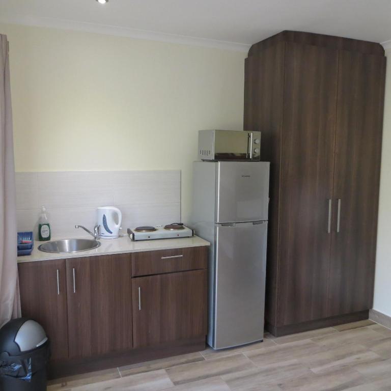 Kuchyň nebo kuchyňský kout v ubytování Cape Oasis Guesthouse