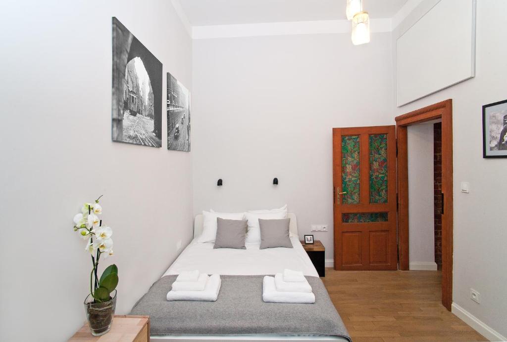 Posteľ alebo postele v izbe v ubytovaní Kurkowa Apartments