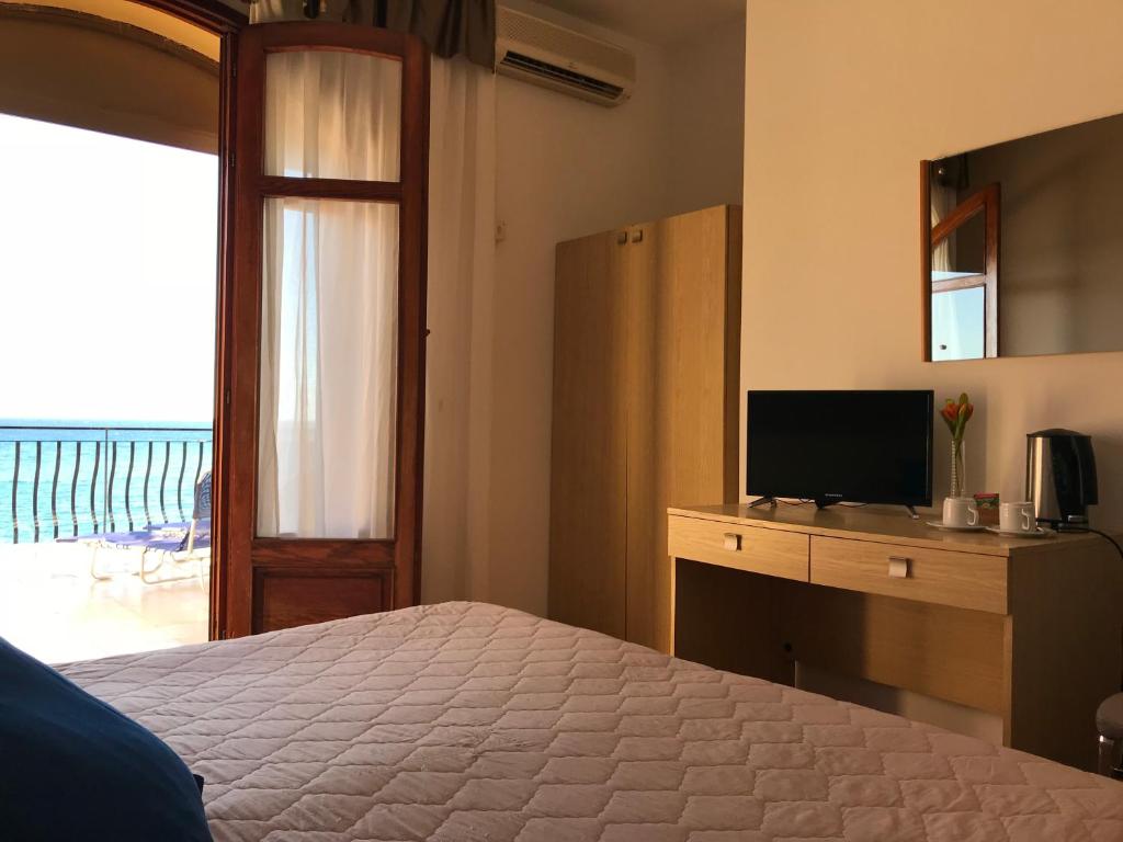 Posteľ alebo postele v izbe v ubytovaní Hotel La Sirenetta