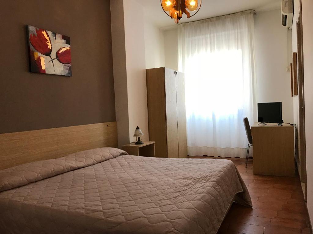 Posteľ alebo postele v izbe v ubytovaní Hotel La Sirenetta