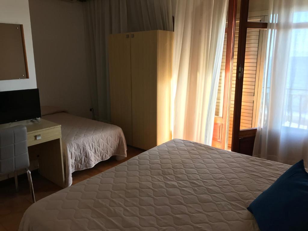 Posteľ alebo postele v izbe v ubytovaní Hotel La Sirenetta