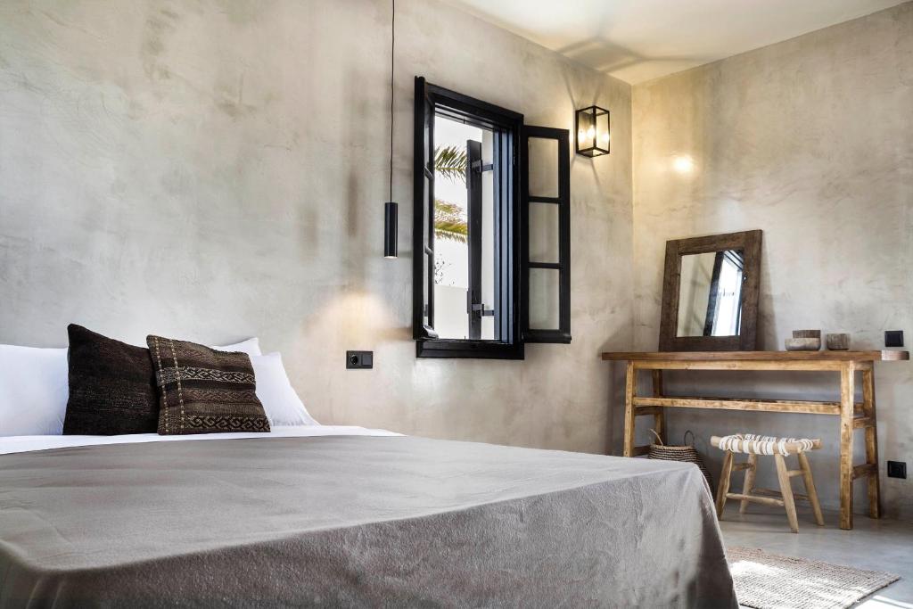 Ένα ή περισσότερα κρεβάτια σε δωμάτιο στο Kymata Bohemian Villas