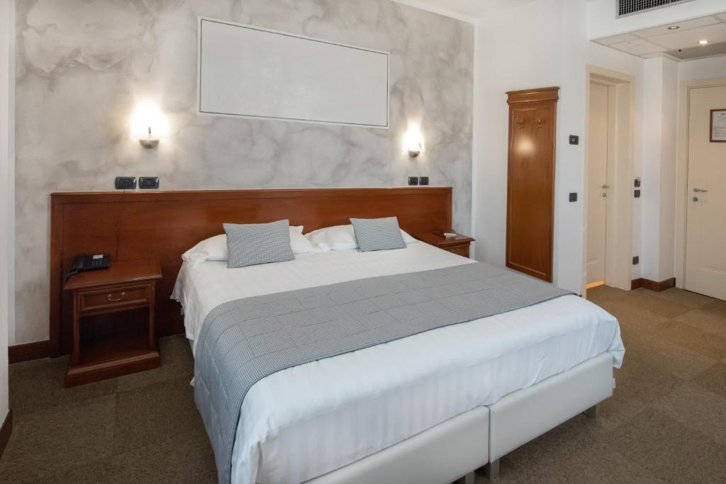 Postel nebo postele na pokoji v ubytování Hotel Medea