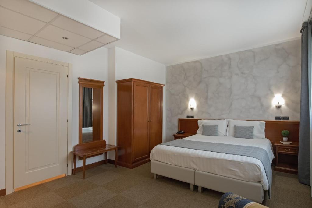 Postel nebo postele na pokoji v ubytování Hotel Medea