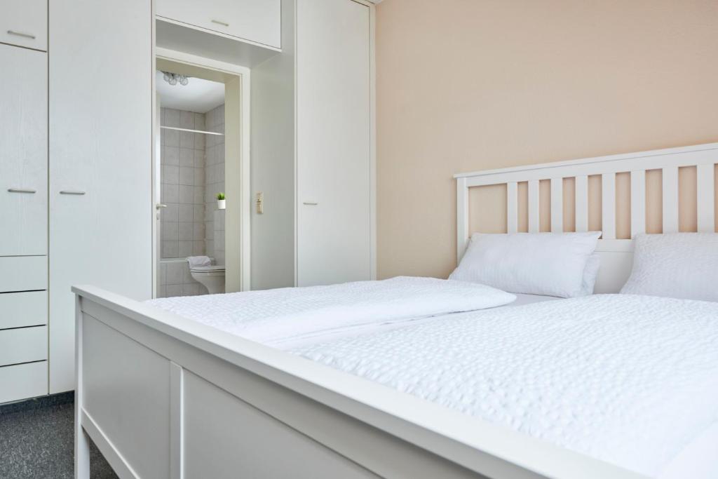 Postel nebo postele na pokoji v ubytování Hotel Asslar