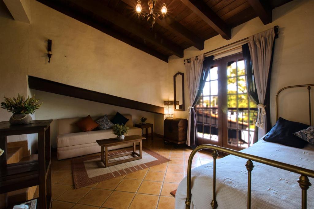 Postel nebo postele na pokoji v ubytování Hacienda La Moreda Hotel Boutique & Spa