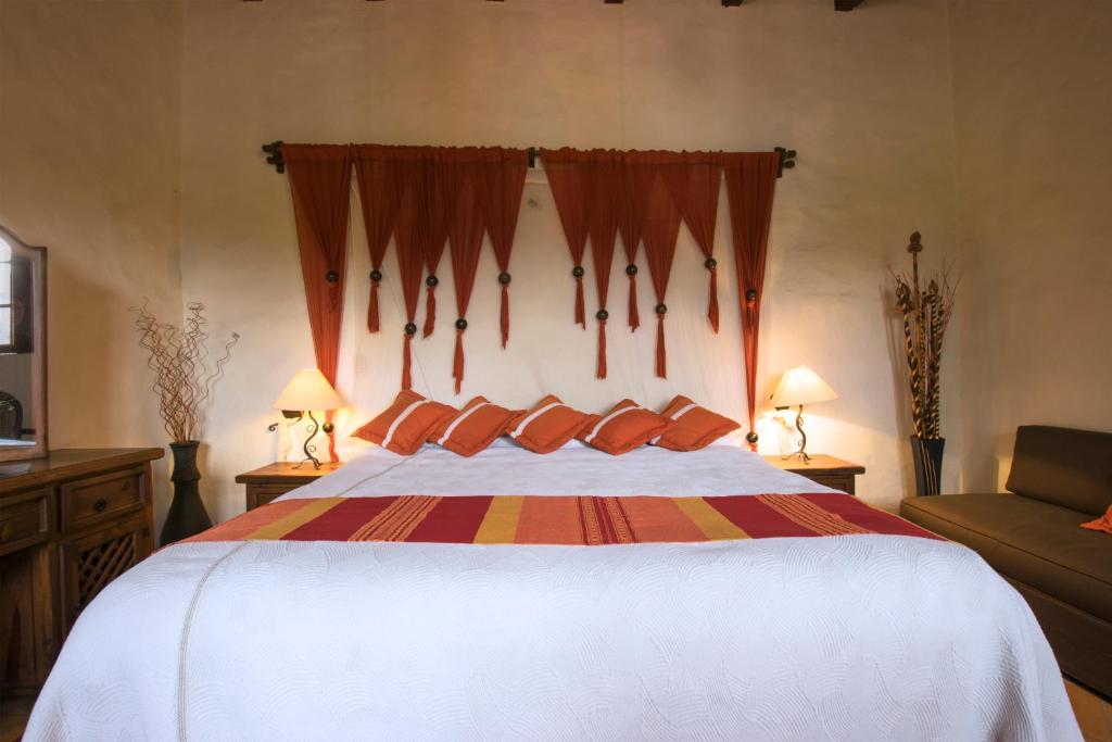 Postel nebo postele na pokoji v ubytování Hacienda La Moreda Hotel Boutique & Spa