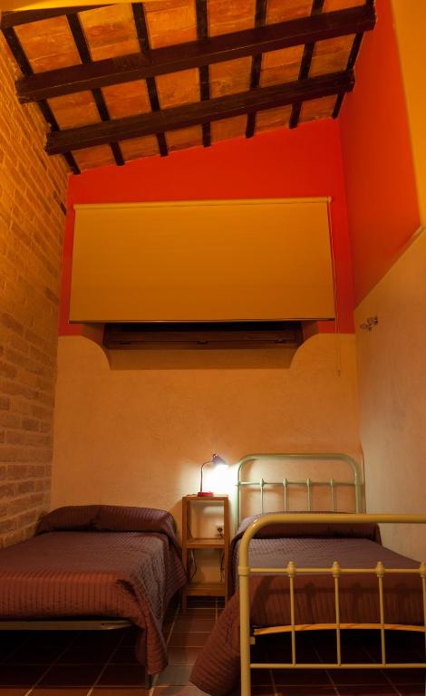 Postel nebo postele na pokoji v ubytování Torre del Prior