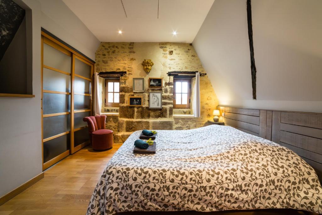 En eller flere senge i et værelse på Toits et Moi