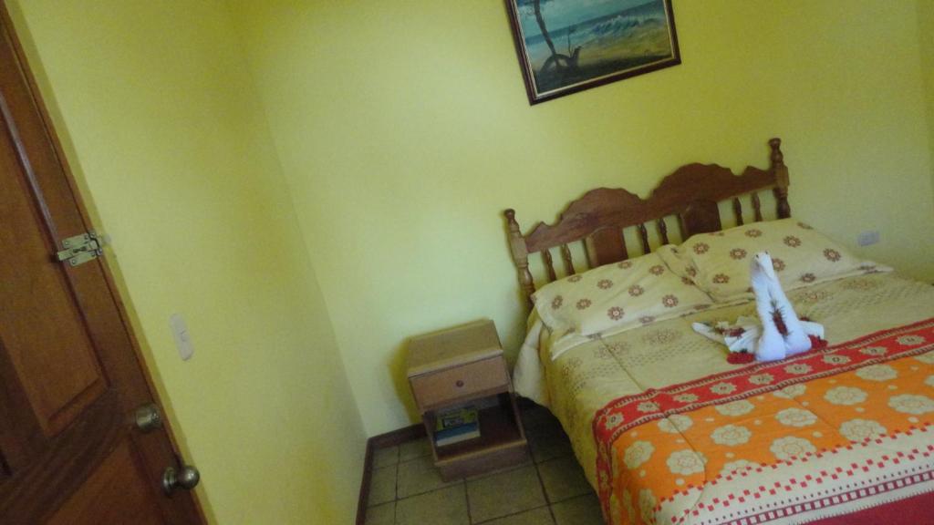 Postel nebo postele na pokoji v ubytování Hotel Santa Ana Liberia Airport