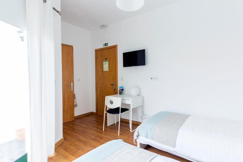 Postel nebo postele na pokoji v ubytování H18