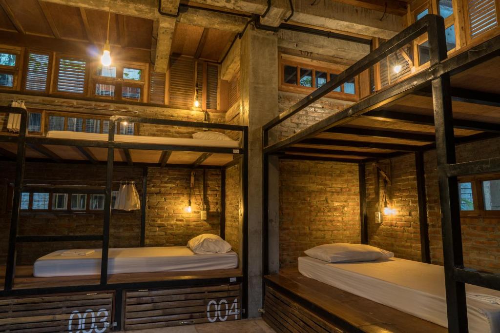 Postel nebo postele na pokoji v ubytování The Flying Fish Hostel