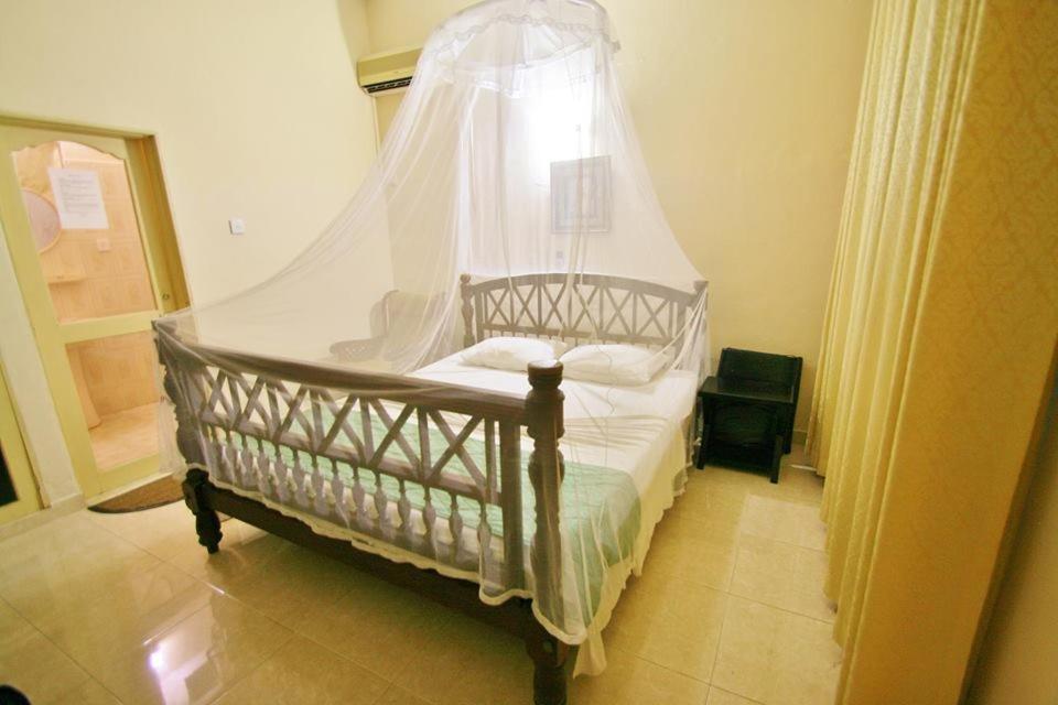 Postel nebo postele na pokoji v ubytování Sagarika Beach Hotel