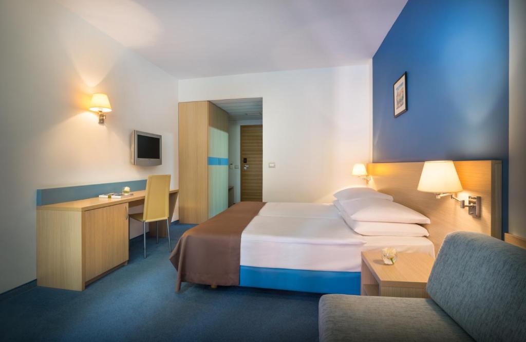 Krevet ili kreveti u jedinici u okviru objekta Remisens Hotel LUCIJA