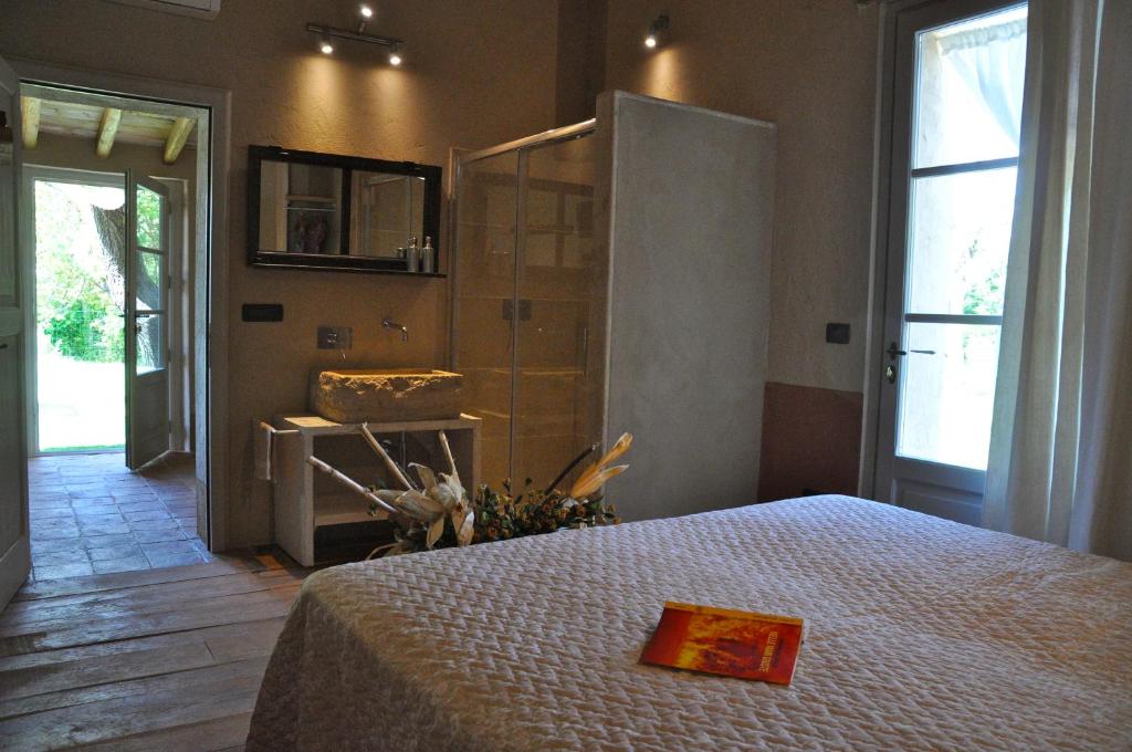 Postel nebo postele na pokoji v ubytování B&B Il Molinello