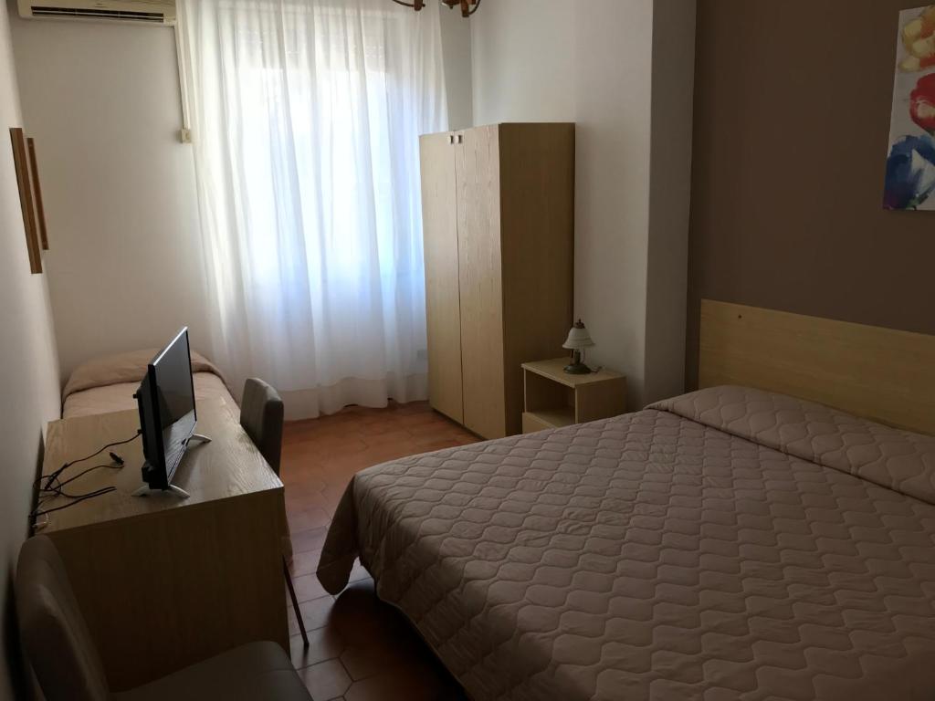 Posteľ alebo postele v izbe v ubytovaní Hotel La Sirenetta