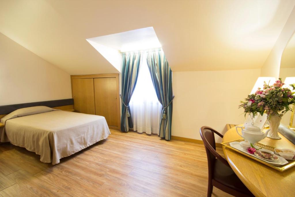 Postel nebo postele na pokoji v ubytování Albert Hotel