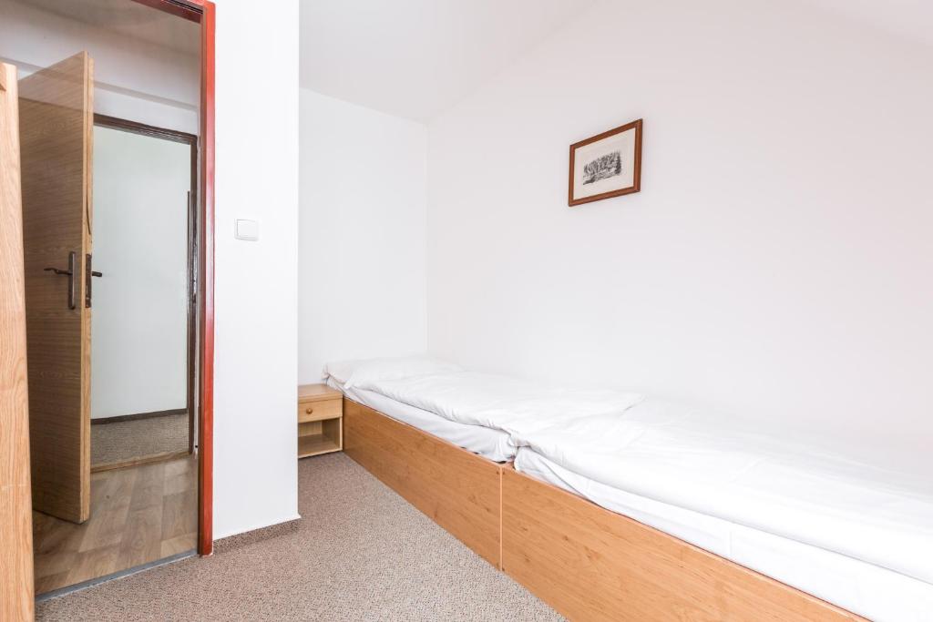 Postel nebo postele na pokoji v ubytování Hotel Gradl