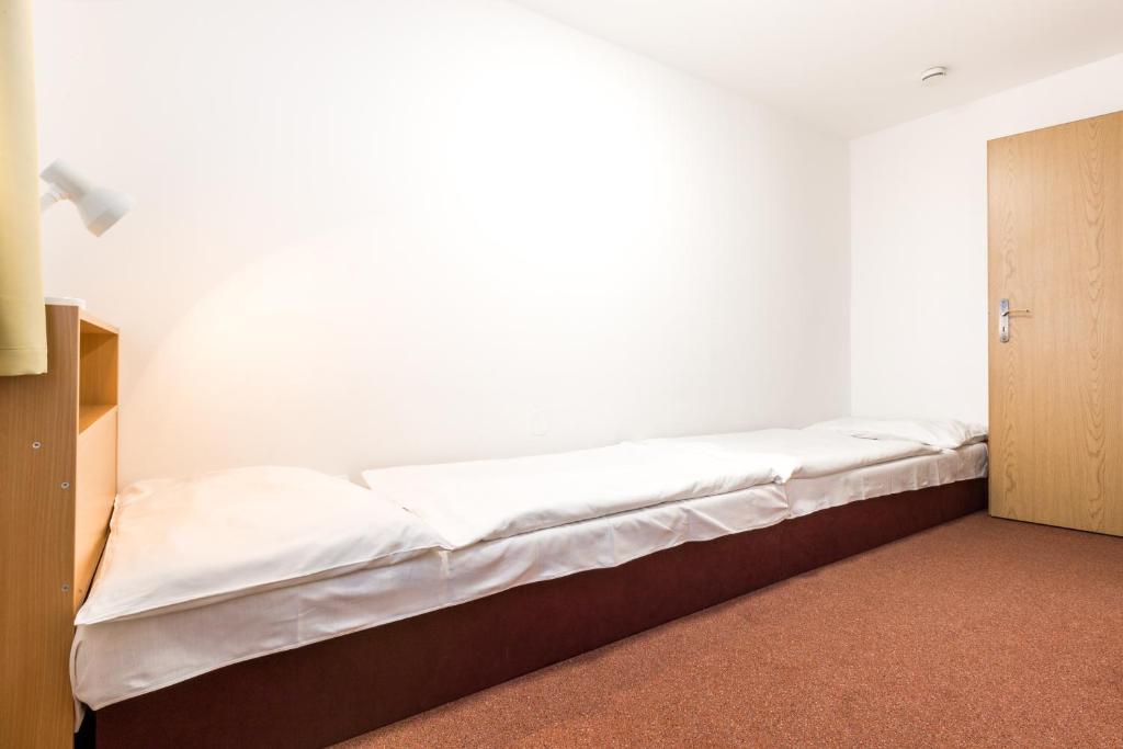 Postel nebo postele na pokoji v ubytování Hotel Gradl