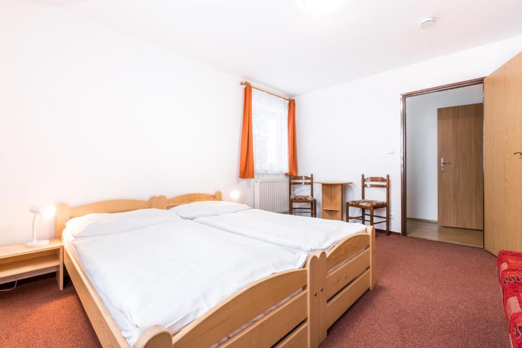 Postel nebo postele na pokoji v ubytování Hotel Gradl