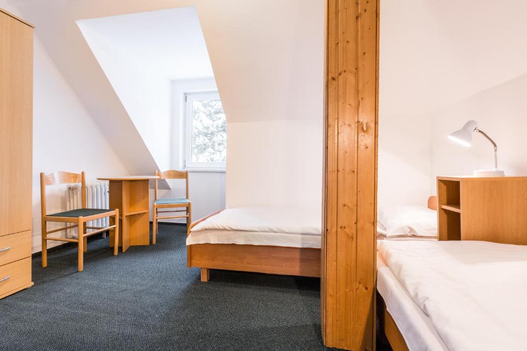 Postel nebo postele na pokoji v ubytování Hotel Gradl