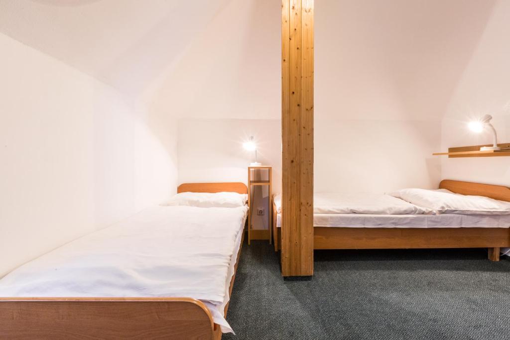 Postel nebo postele na pokoji v ubytování Hotel Gradl