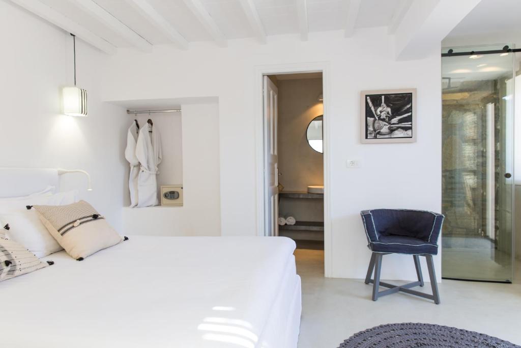 Postel nebo postele na pokoji v ubytování Ostraco Suites
