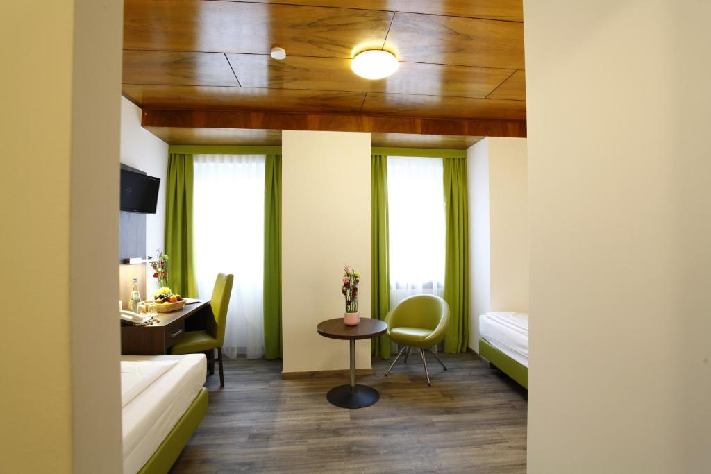 TV a/nebo společenská místnost v ubytování Arthotel ANA Eden
