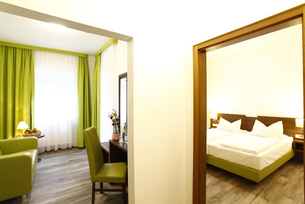 Postel nebo postele na pokoji v ubytování Arthotel ANA Eden