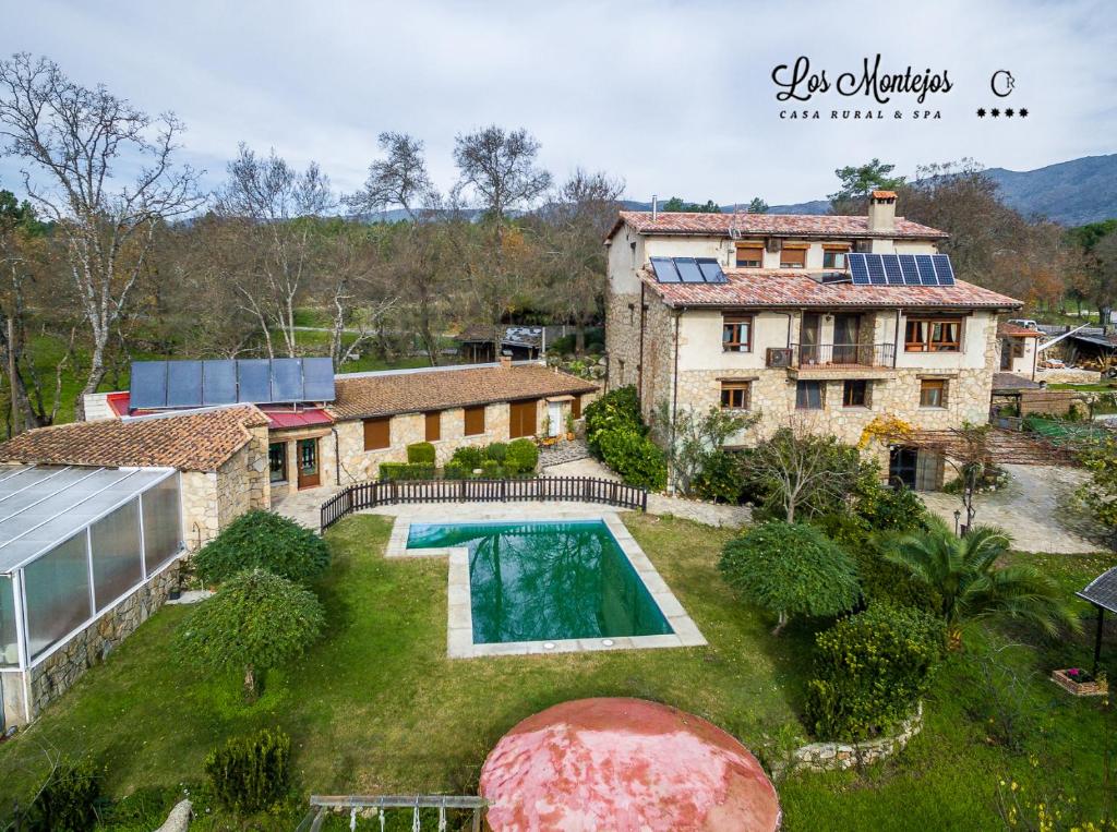 an aerial view of a house with a swimming pool at Los Montejos & Spa in Valverde del Fresno