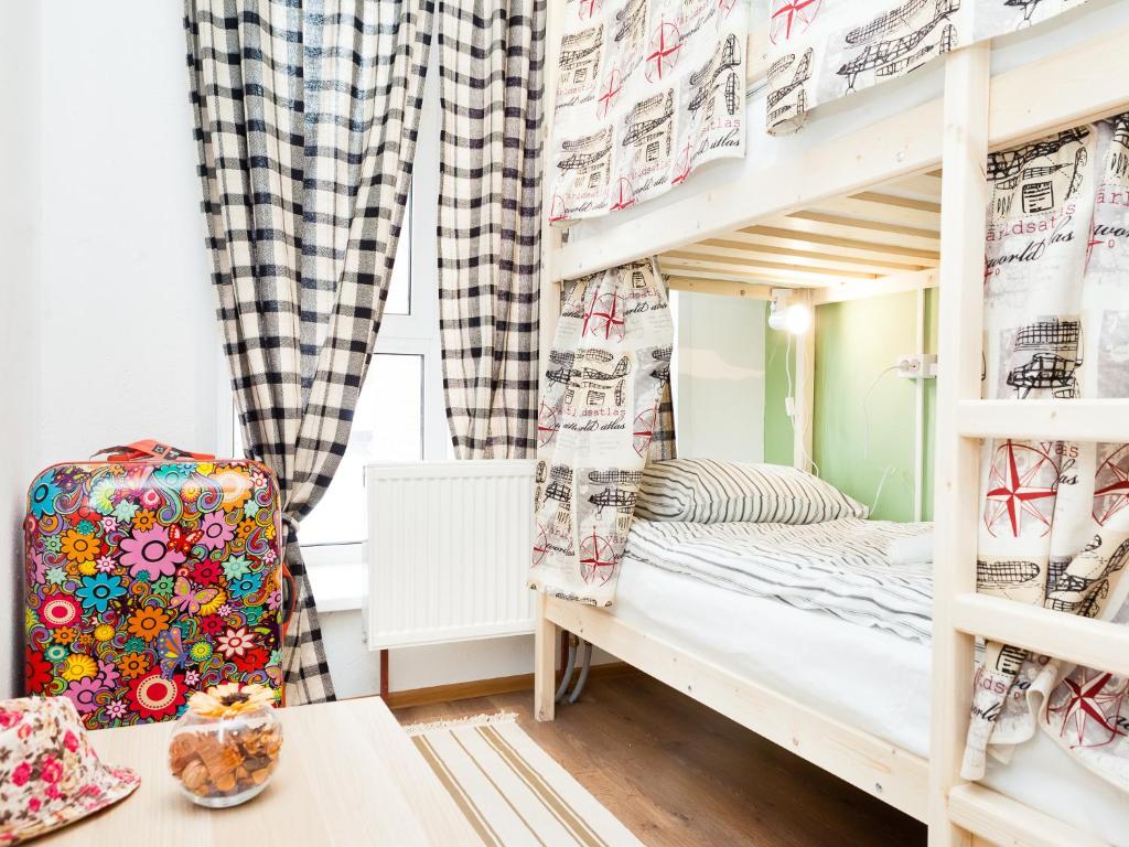 a bunk bed in a childs room with a window at Hostel 9вять Domodedovo in Domodedovo