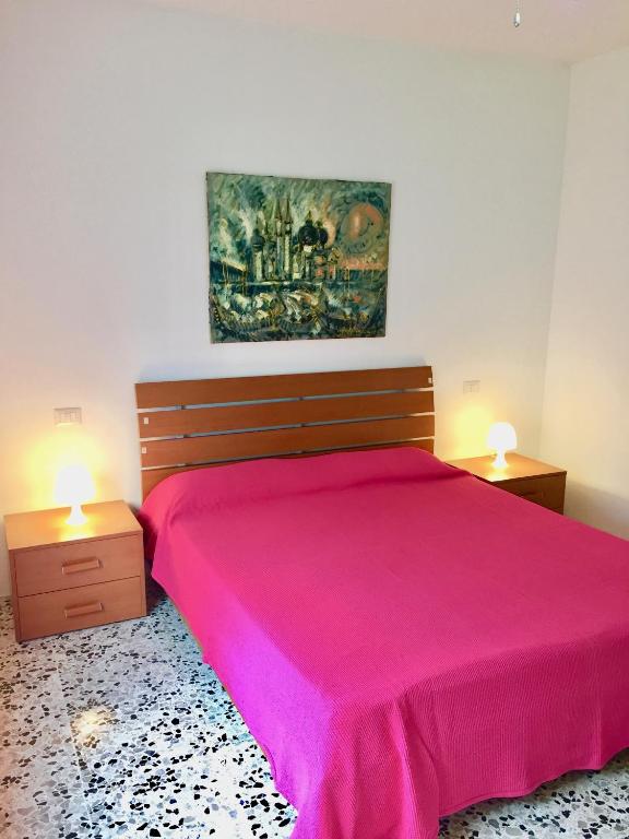 A bed or beds in a room at Salento Appartamenti