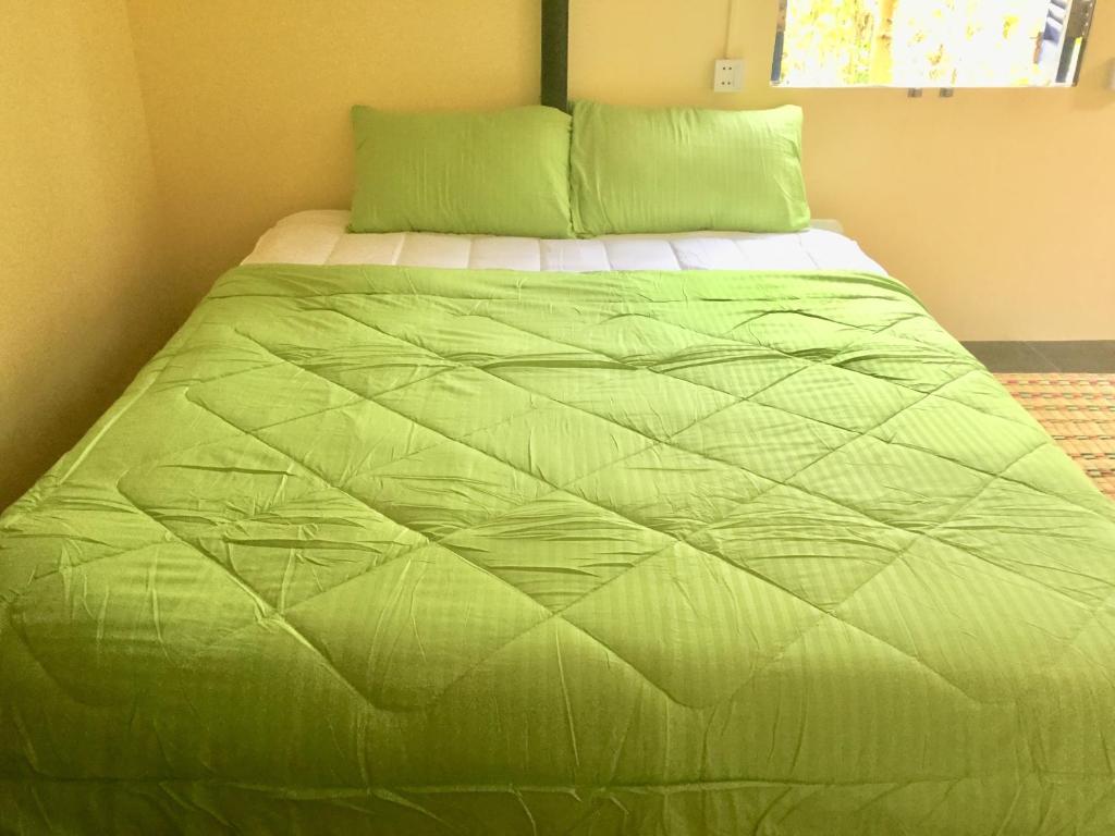 Postel nebo postele na pokoji v ubytování Bunyong Homestay