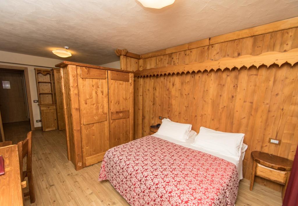 Postel nebo postele na pokoji v ubytování Limone Palace Aparthotel