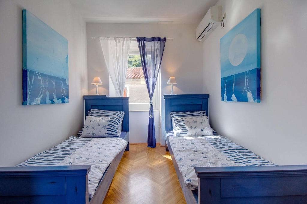 Postel nebo postele na pokoji v ubytování Hotel Sansegus