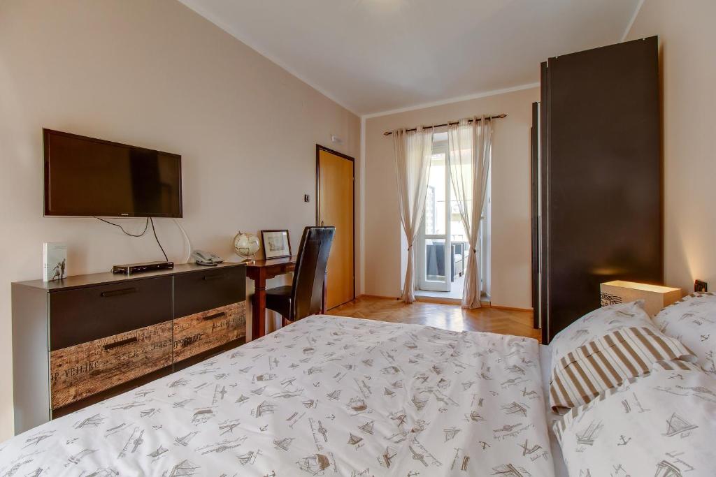 Postel nebo postele na pokoji v ubytování Hotel Sansegus